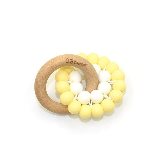 Round wooden teether in natural lemon and white